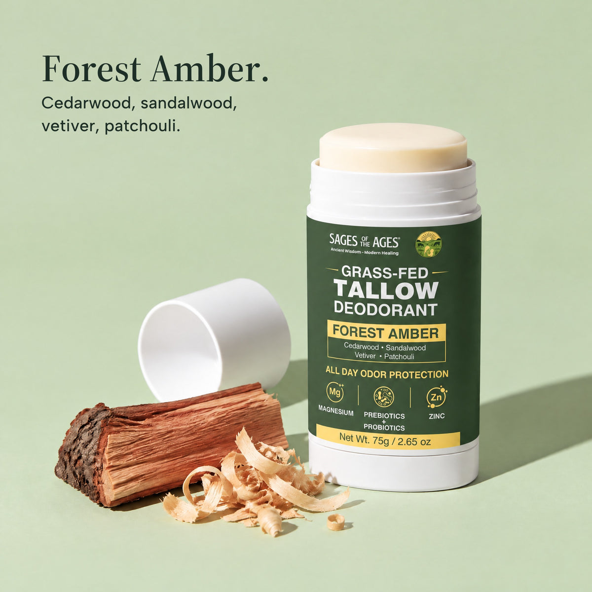 Forest Amber grass-fed tallow deodorant with its cap off, beside split cedar and wood shavings. Forest Amber. Cedarwood, sandalwood, vetiver, patchouli.