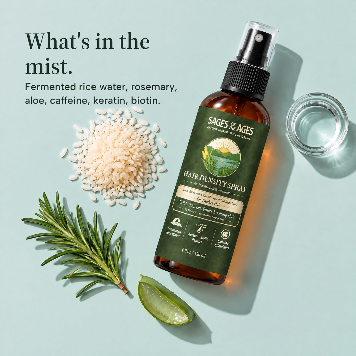 Bottle of fermented rice water and rosemary hair spray laid out with rice, a rosemary sprig, aloe and a glass of water. What's in the mist. Fermented rice water, rosemary, aloe, caffeine, keratin, biotin.
