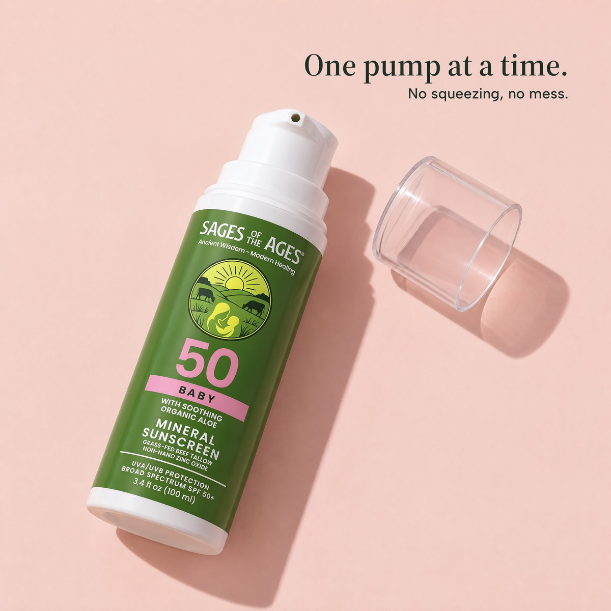 Baby mineral sunscreen SPF 50 pump bottle lying next to its clear cap on a pink background. One pump at a time. No squeezing, no mess.