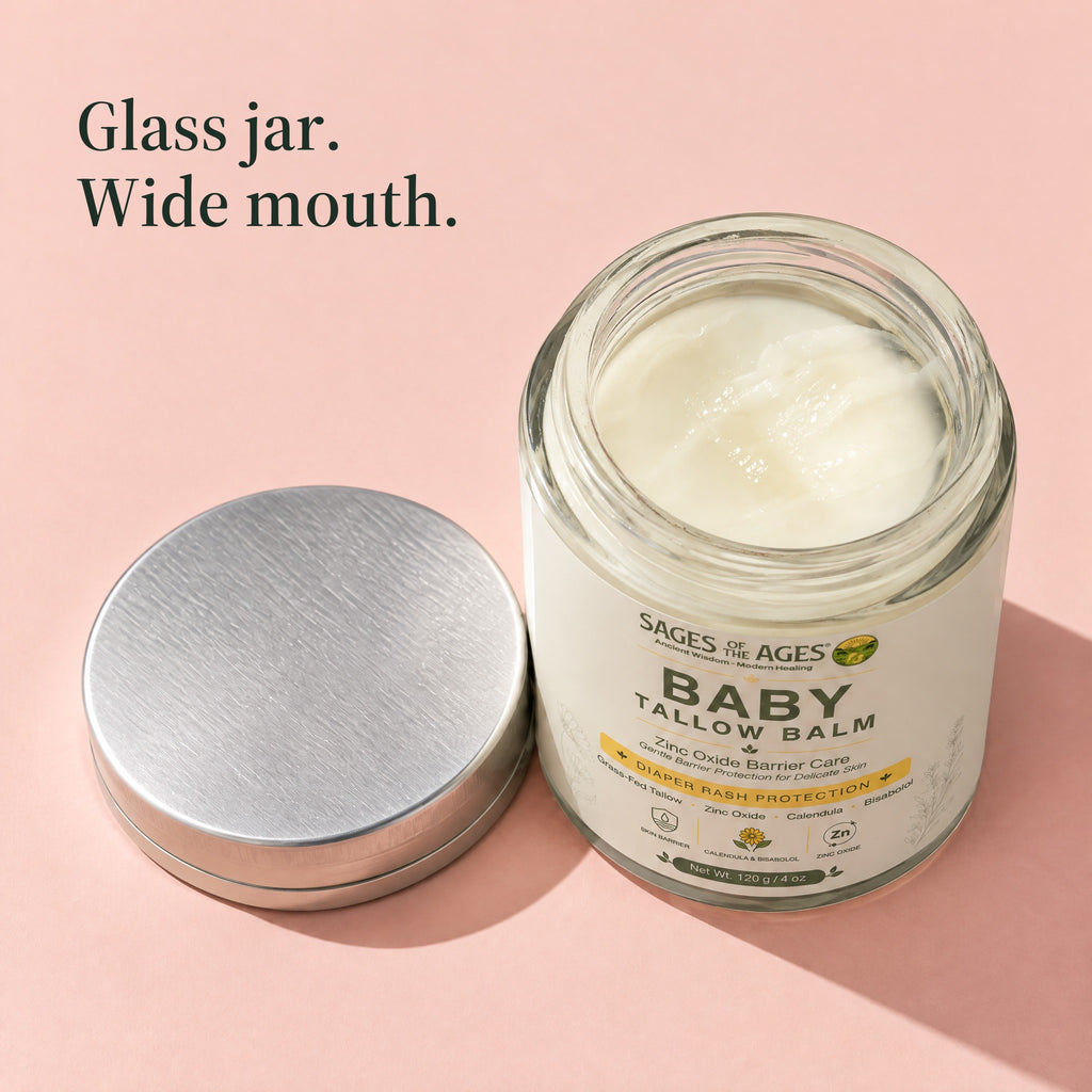 Open jar of baby tallow balm with its silver lid beside it, seen from above. Glass jar. Wide mouth.