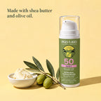Baby mineral sunscreen pump bottle beside a bowl of shea butter and an olive branch. Made with shea butter and olive oil.