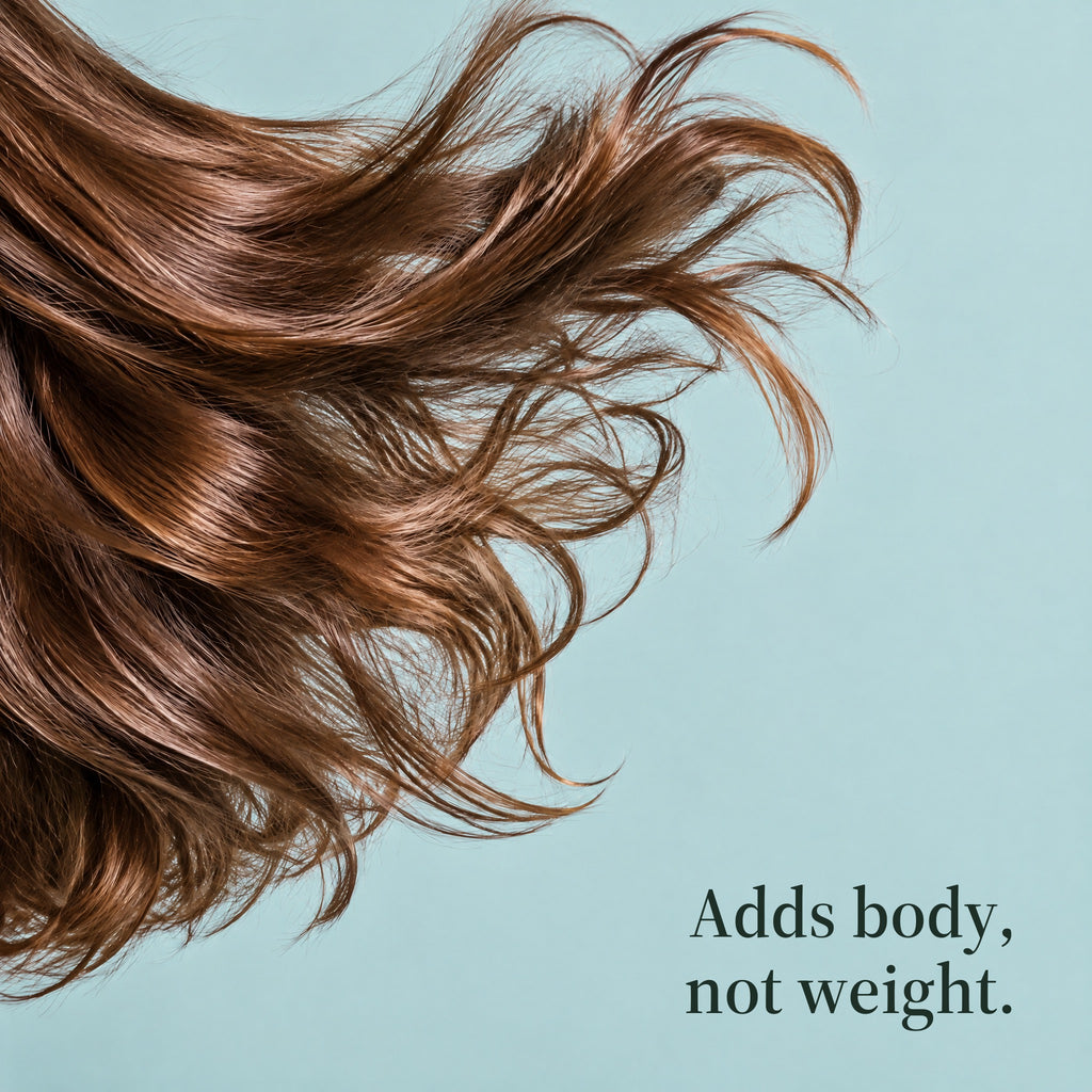 Long brown hair sweeping across a pale blue background. Adds body, not weight.