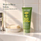Tube of SPF 50 mineral sunscreen lotion on a bathroom basin next to a bar of soap. Wear it like a lotion. Non-greasy. Absorbs quickly.