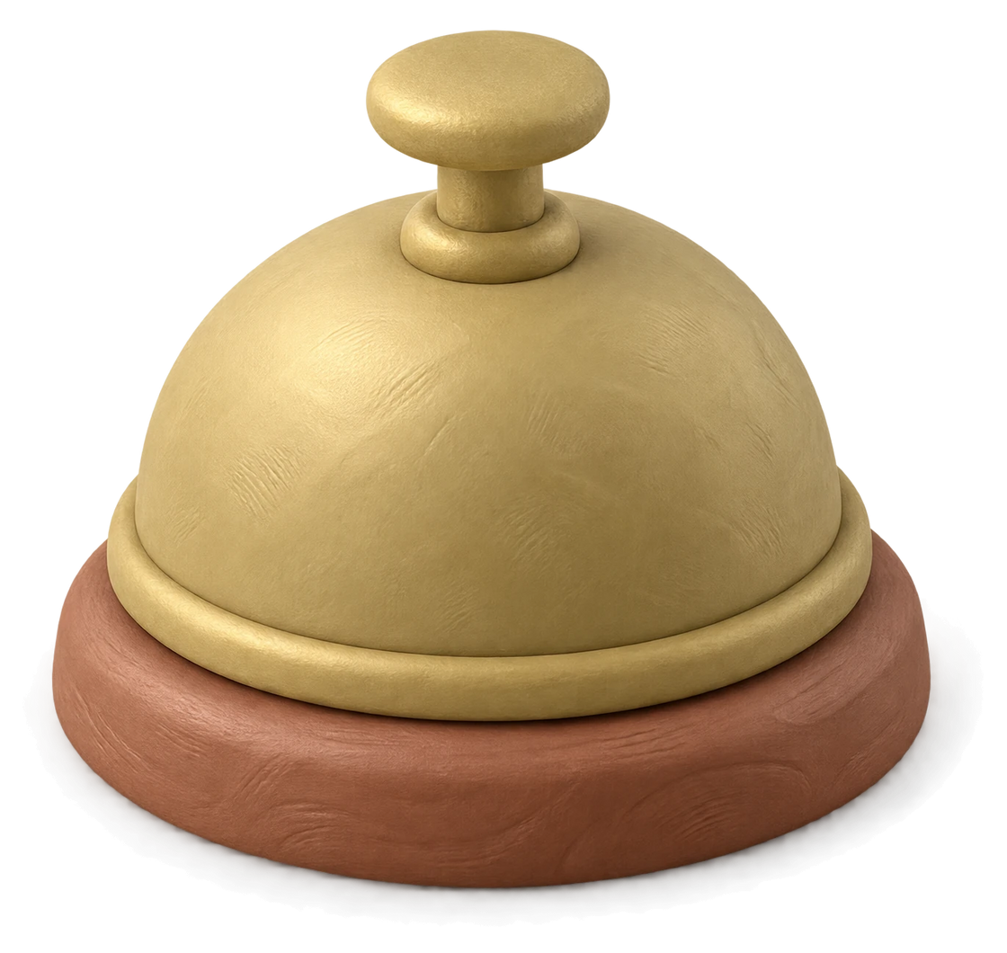 A small brass clay counter bell on a wooden base