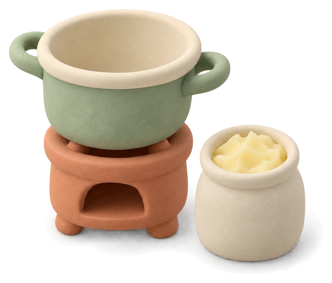 A green clay pot on a little terracotta burner, a cream pot of pale tallow beside it