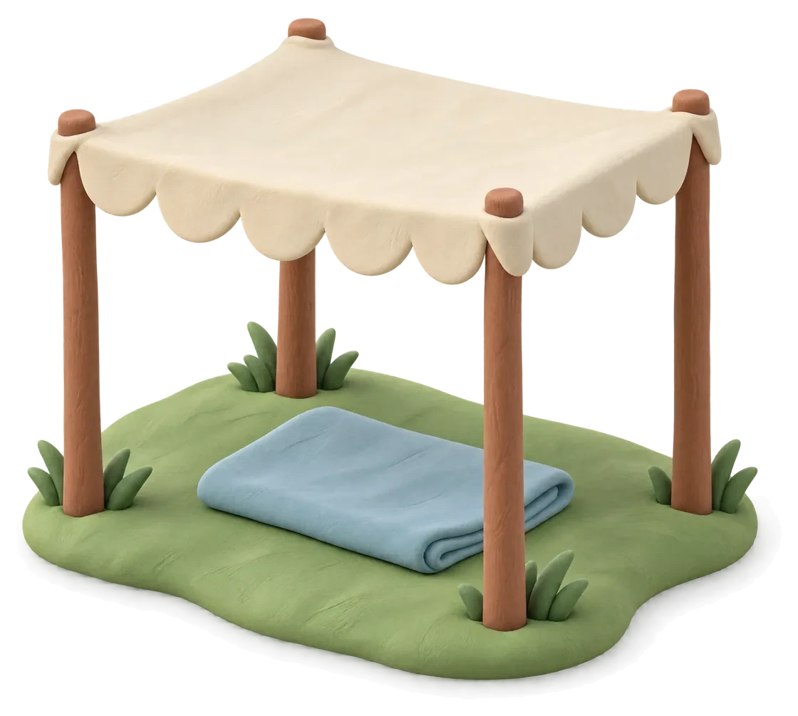 A small cream clay sunshade on four wooden poles over a folded blue blanket on a patch of grass