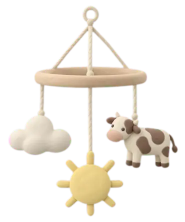 A clay nursery mobile with a cloud, a sun and a little cow hanging from a wooden ring